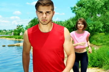 Young people jogging on beach