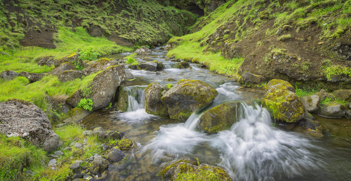 river creek with stones in green canyon in Iceland