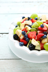 Fresh fruit salad on wooden table
