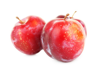 Ripe plums isolated on white