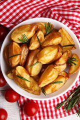 Baked potato wedges on table, closeup