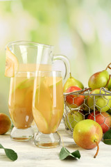 Fresh pear juice with fruit on bright background