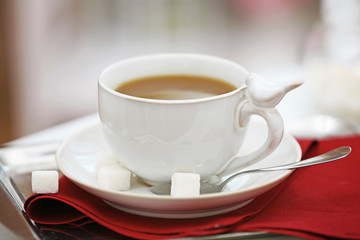 Cup of coffee on table close up