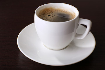 Cup of coffee on table close up