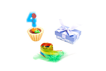 cake with four years birthday candle, whistle and gift