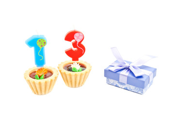 cakes with thirteen years birthday candles and gift
