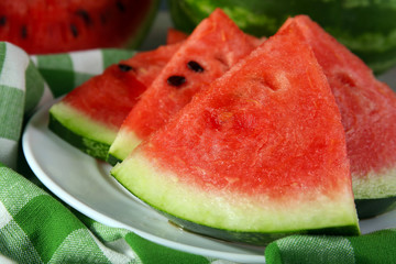 Slices of ripe watermelon on table close up