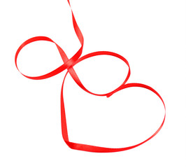 Red ribbon in shape of heart isolated on white