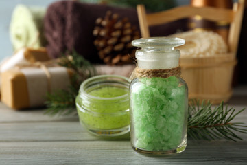 Spa treatments with pine extract on wooden background