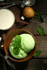 Homemade mint ice-cream on dark wooden background