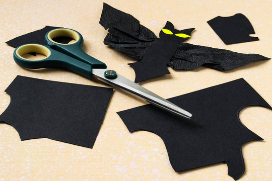 Cutting bat out of black paper