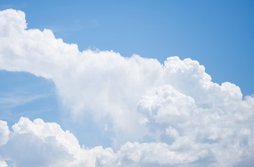Naklejka na ściany i meble white cloud on a blue sky background