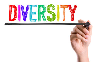 Hand with marker writing the word Diversity