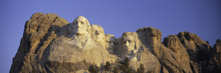 Panoramic sunrise view on Presidents George Washington, Thomas Jefferson, Teddy Roosevelt and...