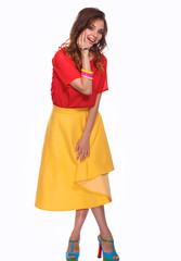 Beautiful woman with curly hair wearing a red jacket, isolated