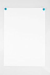 White sheet of paper attached on white background