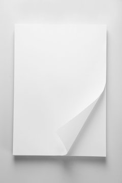 White sheets of paper on white background