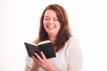 Fototapeta premium Happy woman reads smal notebook