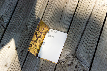 Handmade Open Gold Foil Notebook Outdoors With Pen