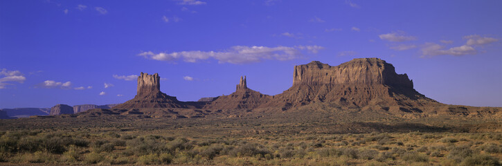 Panoramic view of red buttes and colorful spires of Monument Valley Navajo Tribal Park, Southern Utah near Arizona border