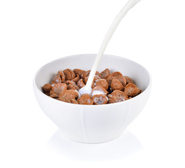 cocoa crunch cornflakes with milk on white background