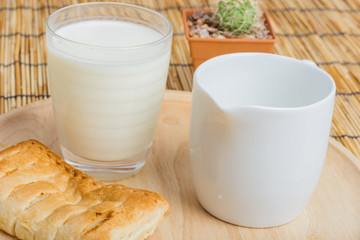Breakfast pitcher of milk and bread