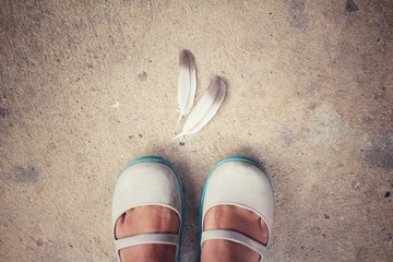 Selfie of shoes with feather