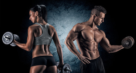 Athletic man and woman with a dumbells. - obrazy, fototapety, plakaty