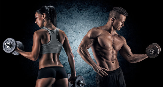Athletic man and woman with a dumbells.