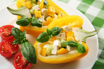 Fresh green salad in pepper on table close up