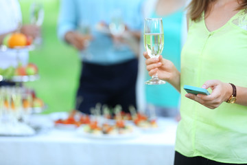 Guests drink champagne on wedding ceremony