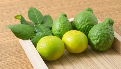 Kaffir Lime with Lemon Lime on A Wooden Tray
