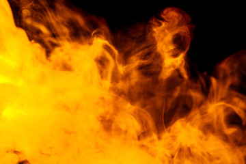 Abstract orange smoke hookah on a black background.