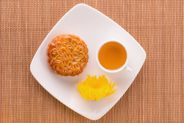 Mooncakes. Traditional Mooncake and hot tea - Chinese cake