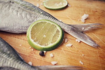 Fresh raw fish ,lemon ,salt and pepper