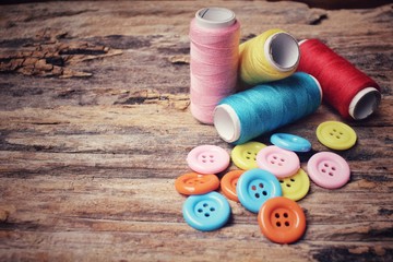 Colorful sewing buttons with thread