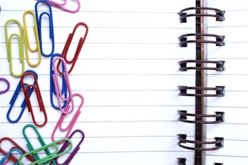 Paper notes with colorful paper clips