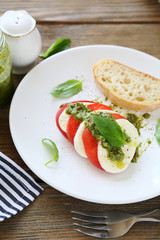 Delicious salad with tomato and cheese