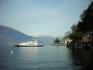 Tranquil lake landscape on Lake Como in Lombardy, Italy, on a quiet sunny morning, with snow...