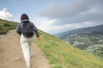 Senior woman walking in the mountain