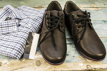 shirt and shoes on wooden boards