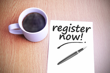 Coffee on the table with note writing register now
