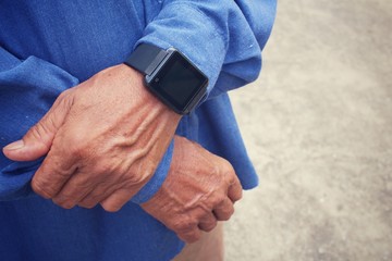 Senior man with smartwatch