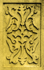 Ancient gold stone plate with vintage ornament