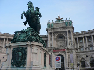 Fototapeta na wymiar Vienna, Austria - October 14, 2010: Bronze statue of horse rider on background of palace