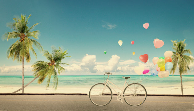 bicycle vintage with heart balloon on beach blue sky concept of love in summer and wedding honeymoon