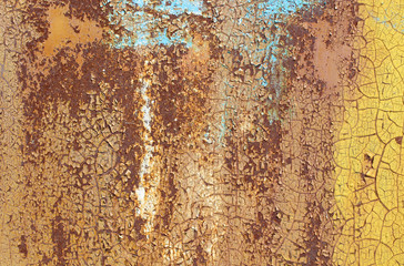 Rusty iron wall covered with paint