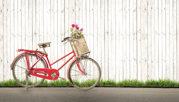 bicycle vintage with bouquet flower concept of love in summer and wedding honeymoon, white wood background