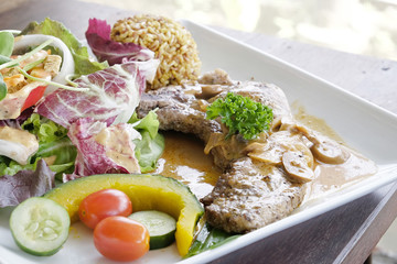Pork chop steak with salad