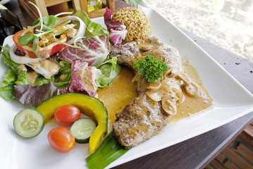Pork chop steak with salad